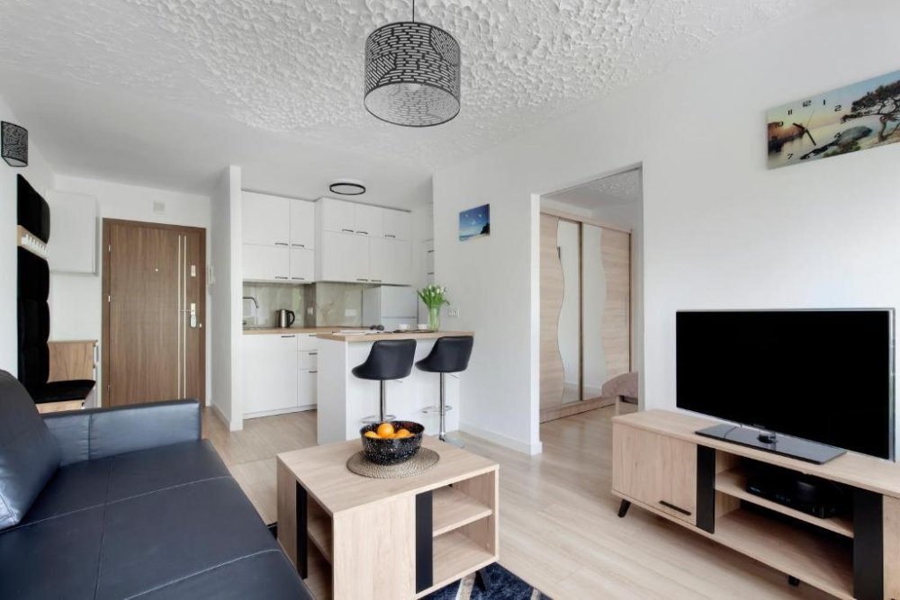 Salon z aneksem kuchennym w obiekcie Gdynia Mare Apartment