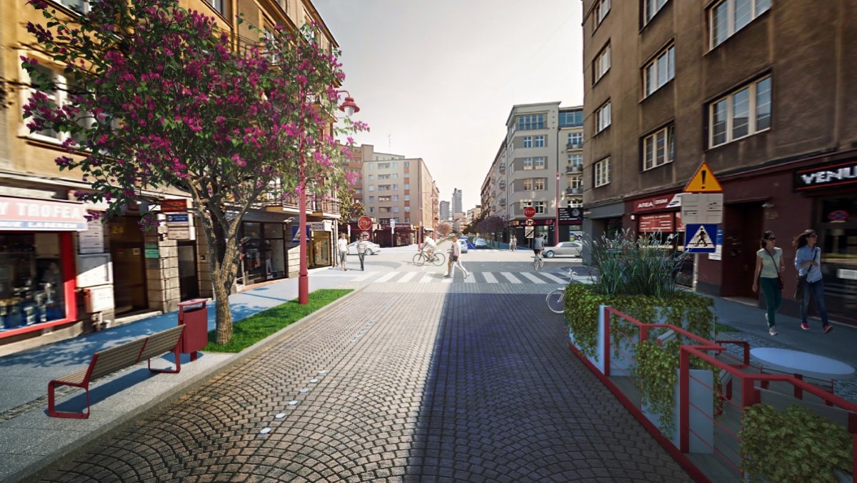 Trójwymiarowa wizualizacja ulicy Starowiejskiej w Gdyni. Widoczny bruk, budynki, samochody, pieszy, drzewa i kwiaty
