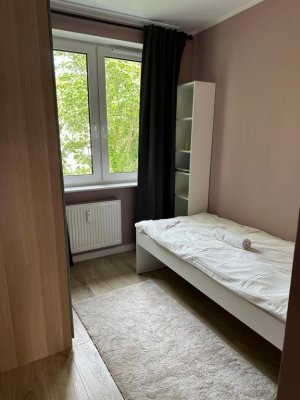 Jedna z sypialni w obiekcie Charming Apartment Boulvard