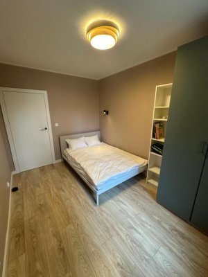 Jedna z sypialni w obiekcie Charming Apartment Boulvard