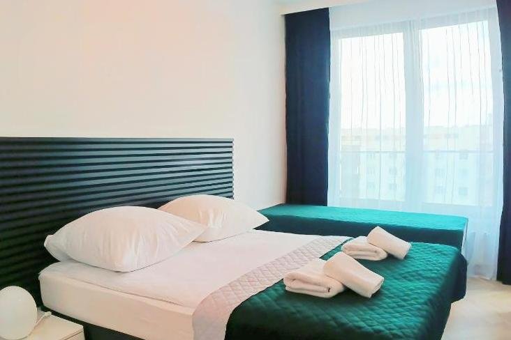 Sypialnia w obiekcie Sleepy3city - Apartamenty Plac Unii