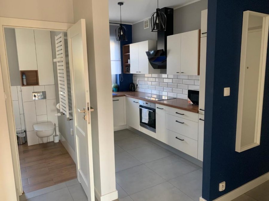 Łazienka oraz kuchnia w obiekcie Apartament 27