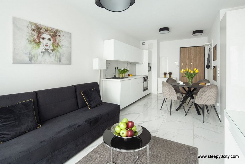 Salon z aneksem kuchennym w obiekcie Sleep3city Plac Unii