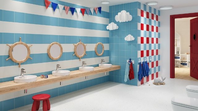 wizualizacja sanitariatów w przedszkolu, biało-niebieskie ściany. okrągłe, drewniane lustra