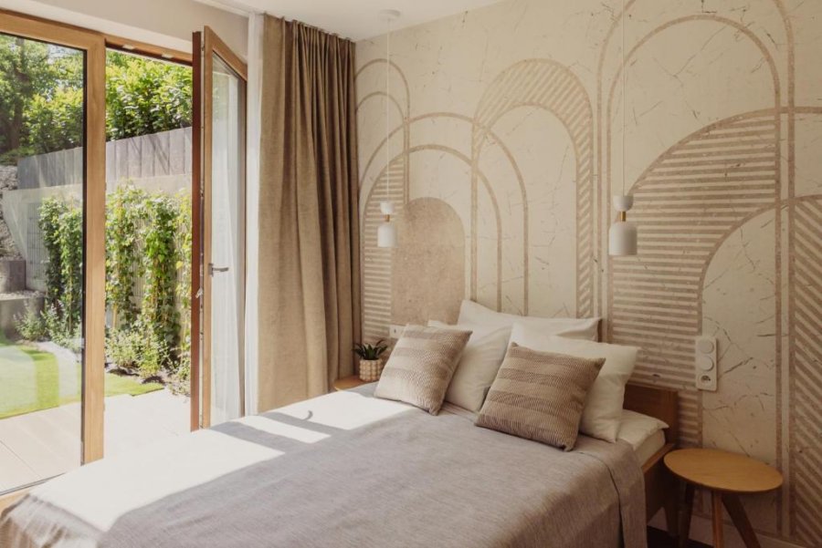 Sypialnia w jedenym z apartament&oacute;w w obiekcie Green Hill Gdynia Orłowo A