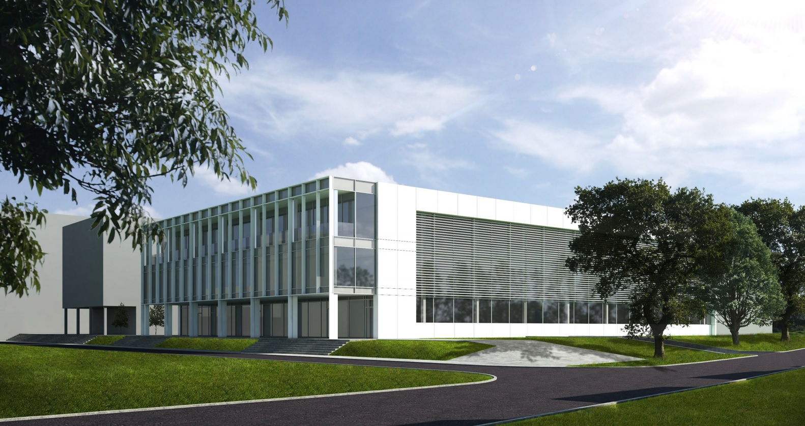 Biały budynek na tle zielonego terenu. Wizualizacja hali sportowej, kt&oacute;ra ma powstać na terenie kampusu Uniwersytetu Morskiego przy ul. Morskiej // fot. materiały UMG