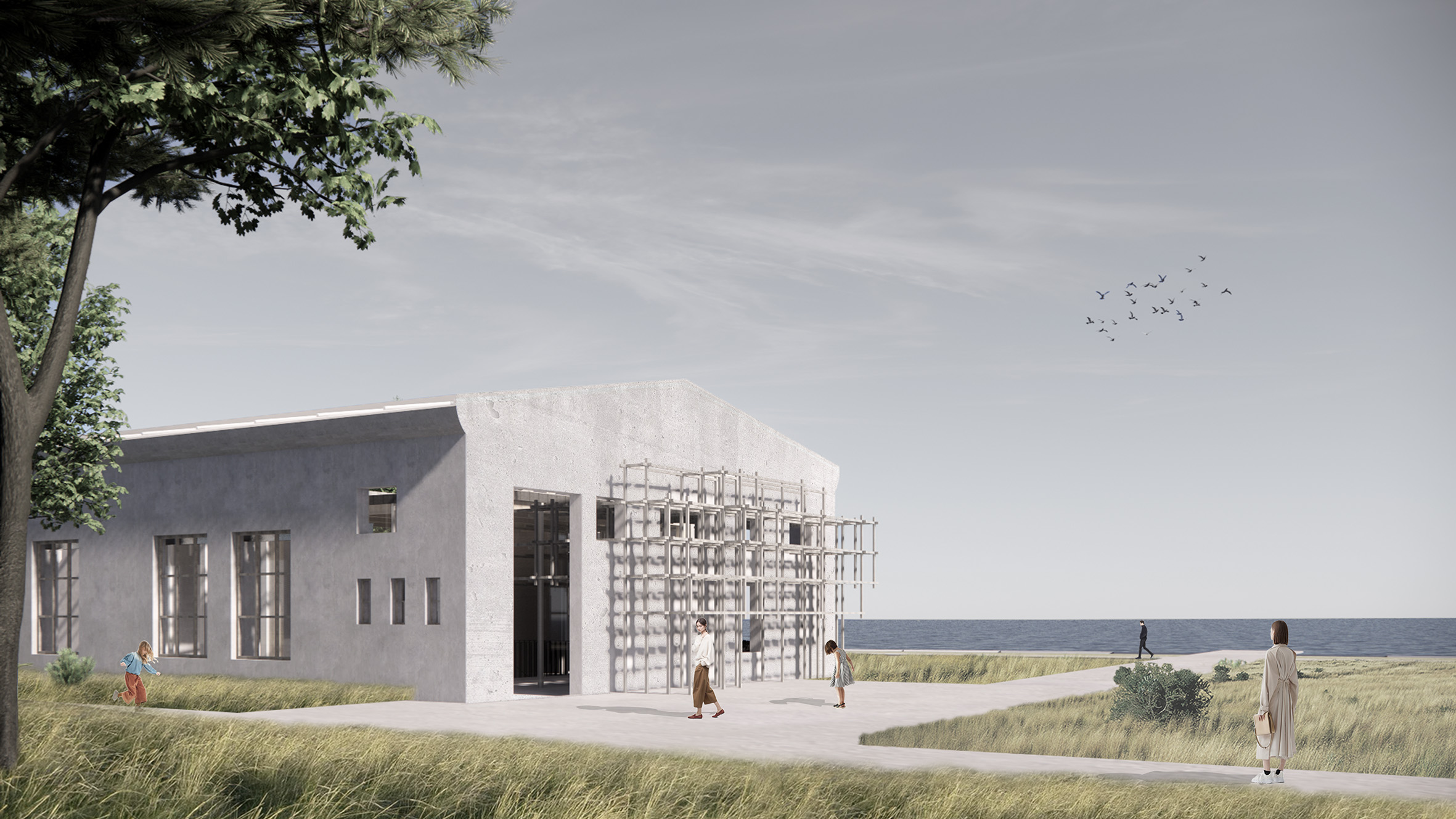 Wizualizacja budynku na lądzie. Szary, betonowy budynek, w tle widoczne jest morze oraz ptaki na niebie. Fot. mat. prasowe